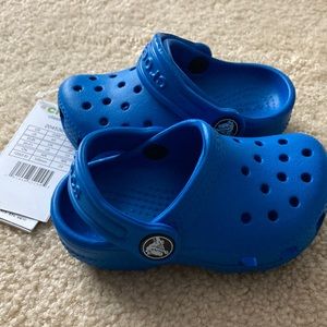 Blue Crocs. New with tags. Size 5.